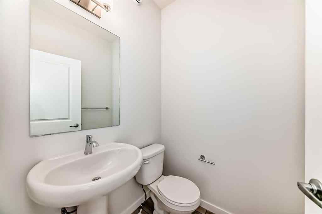 MLS® A2245235 - 21306 Sheriff King Street SW in Pine Creek Calgary, Residential