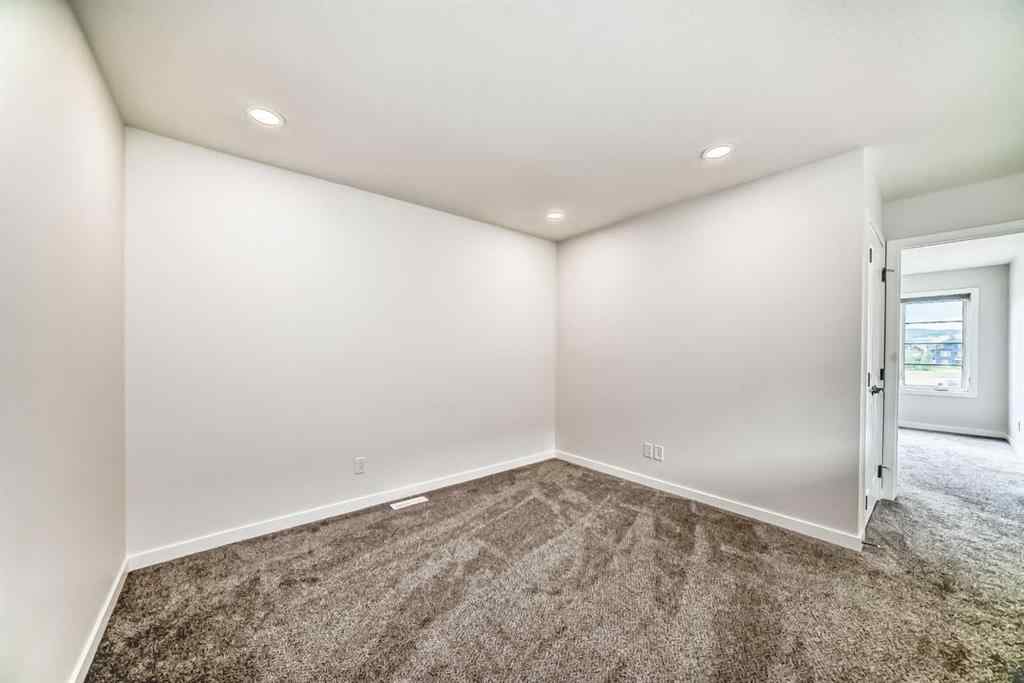 MLS® A2245235 - 21306 Sheriff King Street SW in Pine Creek Calgary, Residential