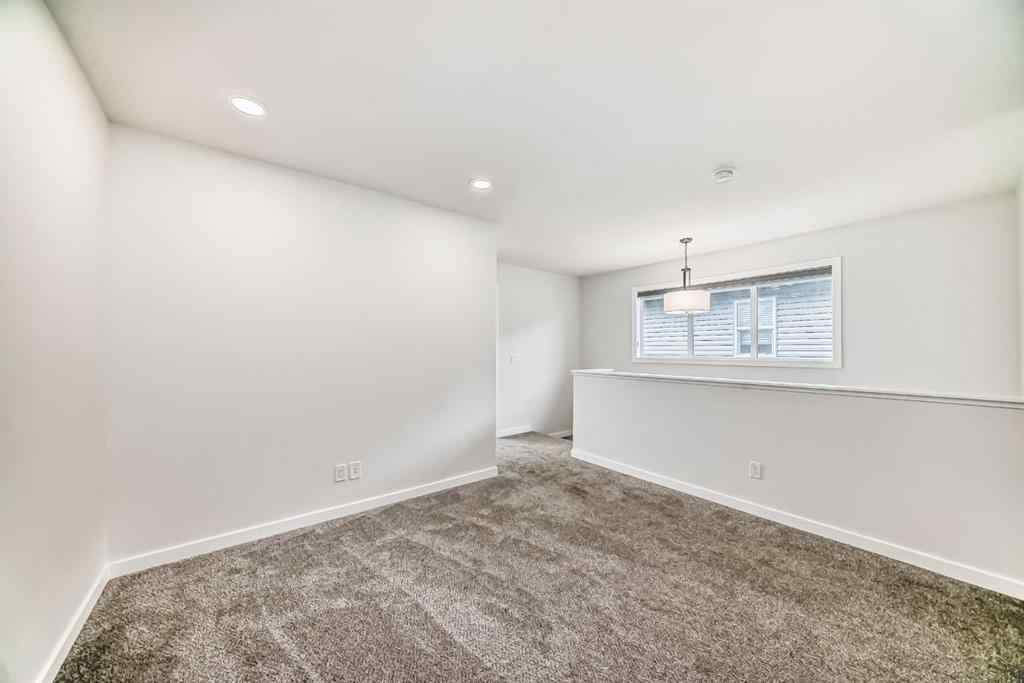 MLS® A2245235 - 21306 Sheriff King Street SW in Pine Creek Calgary, Residential