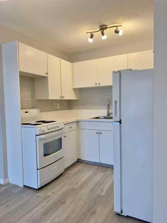 MLS® A2245316 - Unit #406C 5601 Dalton Drive NW in Dalhousie Calgary, Residential