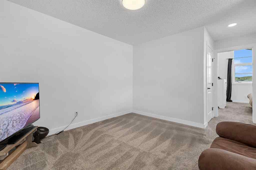 MLS® A2245350 - 21258 SHERIFF KING Street SW in Pine Creek Calgary, Residential