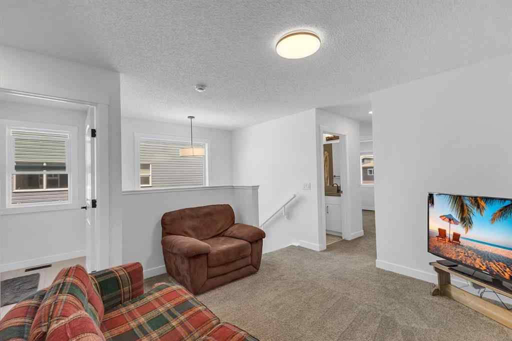 MLS® A2245350 - 21258 SHERIFF KING Street SW in Pine Creek Calgary, Residential