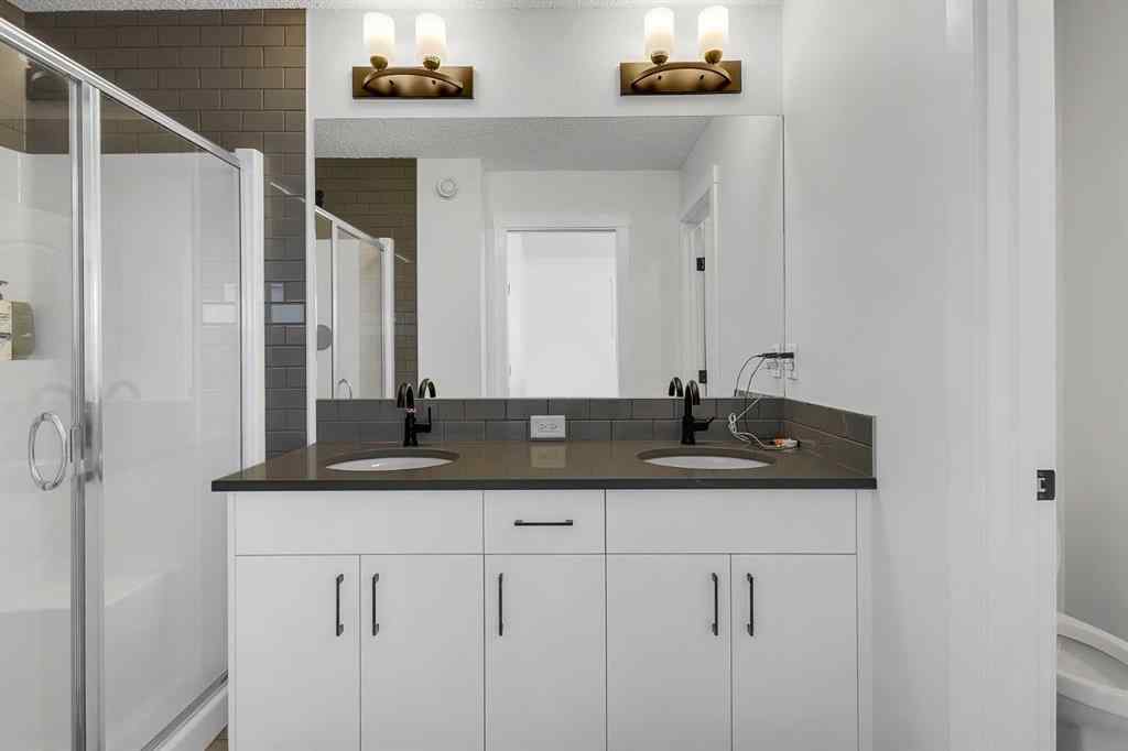 MLS® A2245350 - 21258 SHERIFF KING Street SW in Pine Creek Calgary, Residential