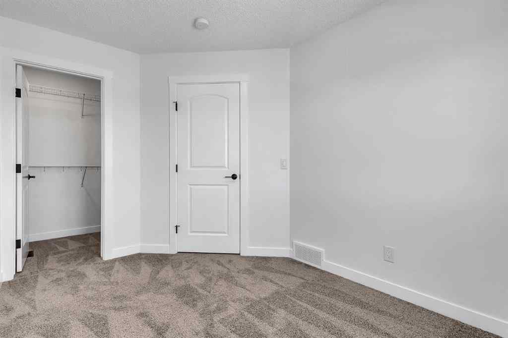 MLS® A2245350 - 21258 SHERIFF KING Street SW in Pine Creek Calgary, Residential
