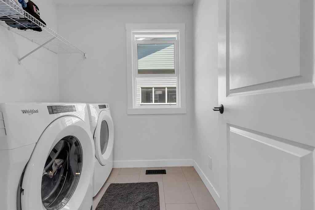 MLS® A2245350 - 21258 SHERIFF KING Street SW in Pine Creek Calgary, Residential