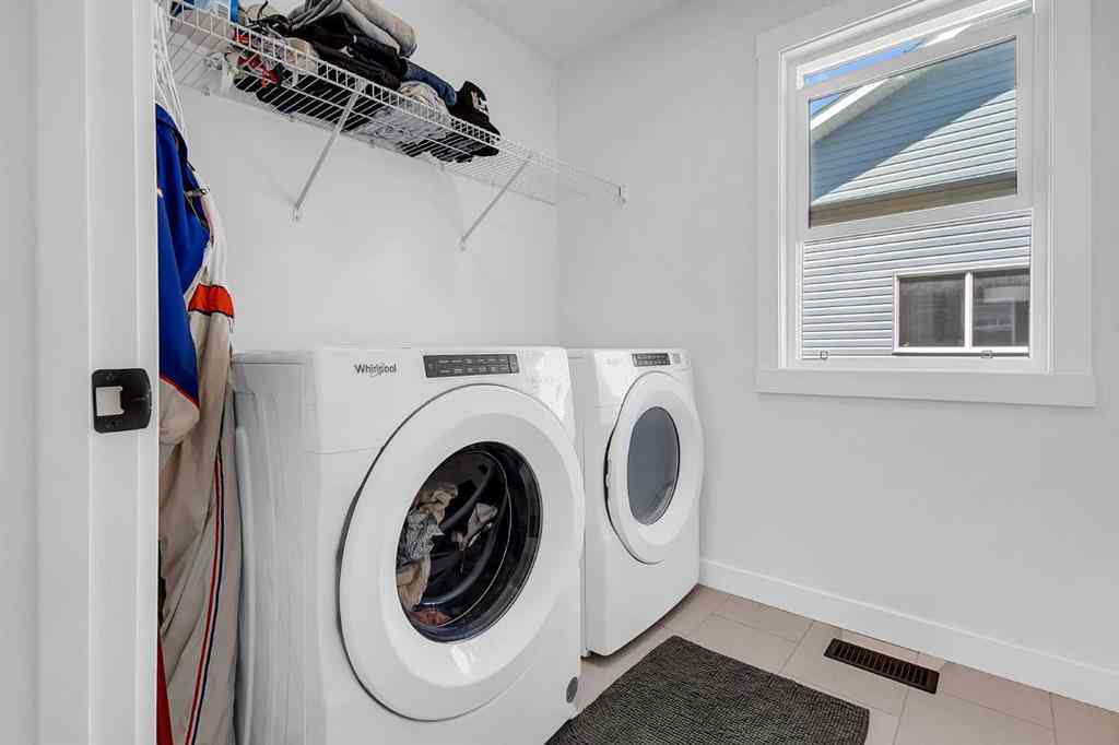 MLS® A2245350 - 21258 SHERIFF KING Street SW in Pine Creek Calgary, Residential