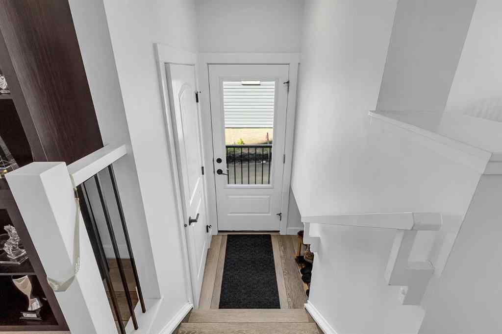 MLS® A2245350 - 21258 SHERIFF KING Street SW in Pine Creek Calgary, Residential