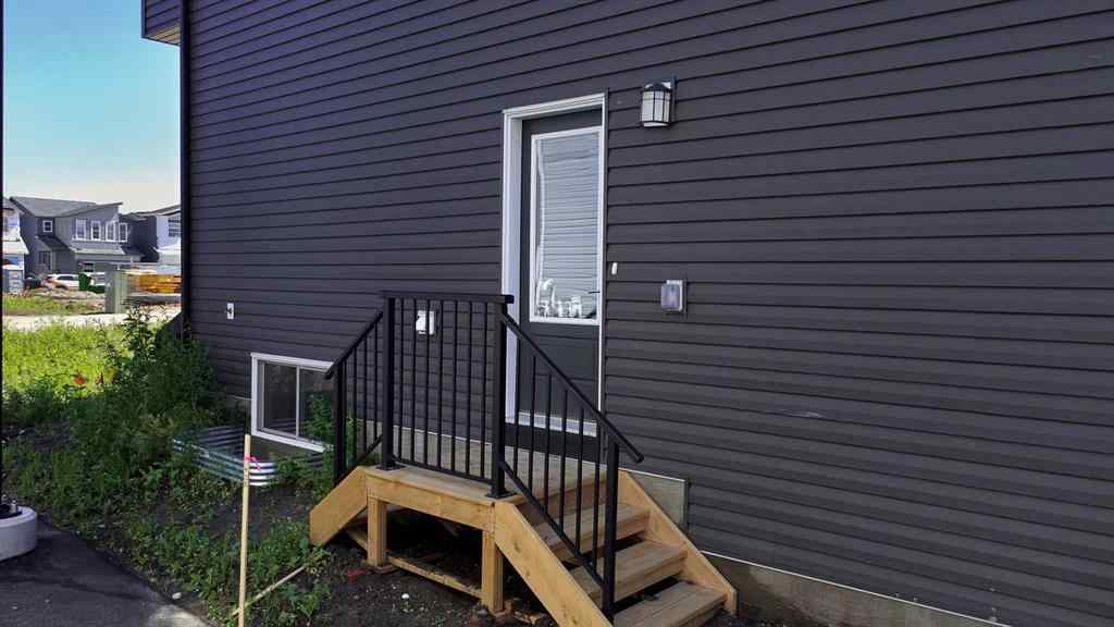 MLS® A2245350 - 21258 SHERIFF KING Street SW in Pine Creek Calgary, Residential