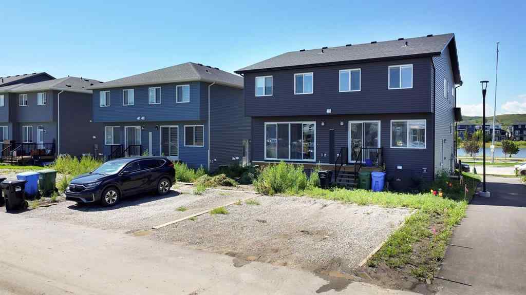 MLS® A2245350 - 21258 SHERIFF KING Street SW in Pine Creek Calgary, Residential