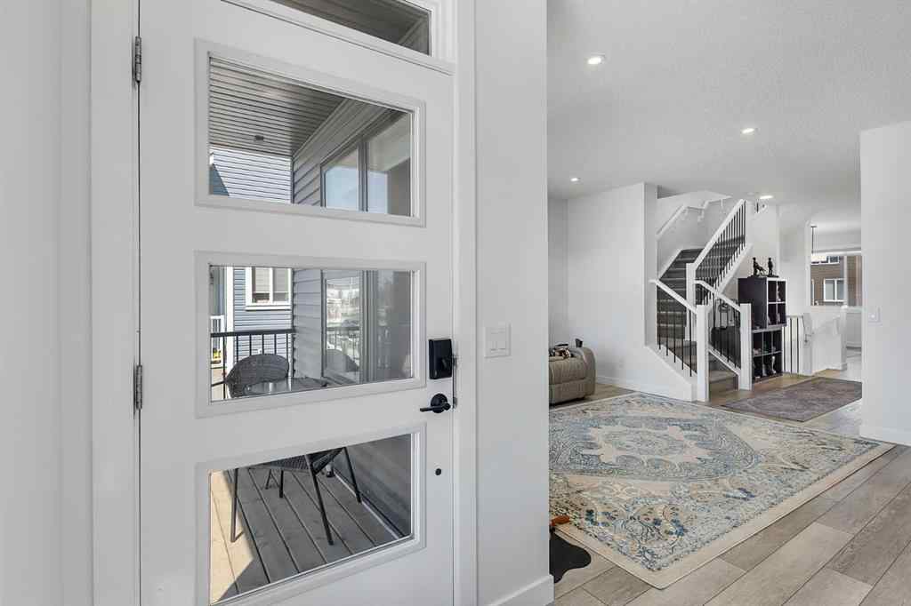 MLS® A2245350 - 21258 SHERIFF KING Street SW in Pine Creek Calgary, Residential