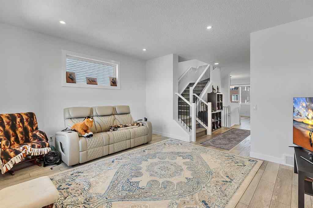 MLS® A2245350 - 21258 SHERIFF KING Street SW in Pine Creek Calgary, Residential