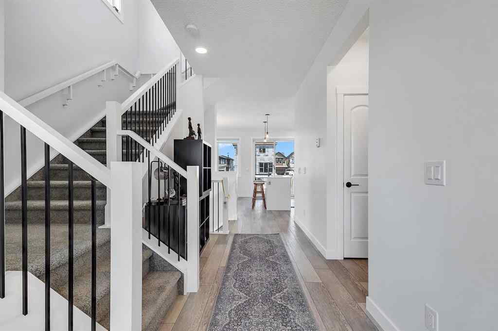 MLS® A2245350 - 21258 SHERIFF KING Street SW in Pine Creek Calgary, Residential