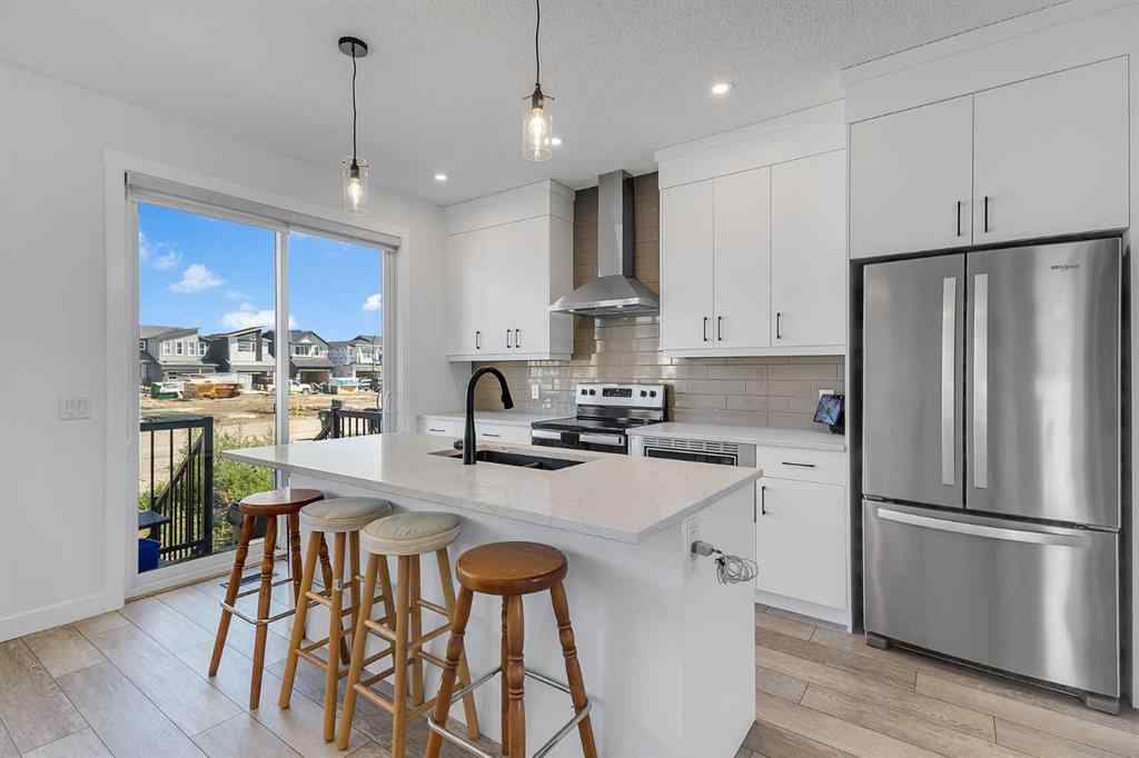 MLS® A2245350 - 21258 SHERIFF KING Street SW in Pine Creek Calgary, Residential