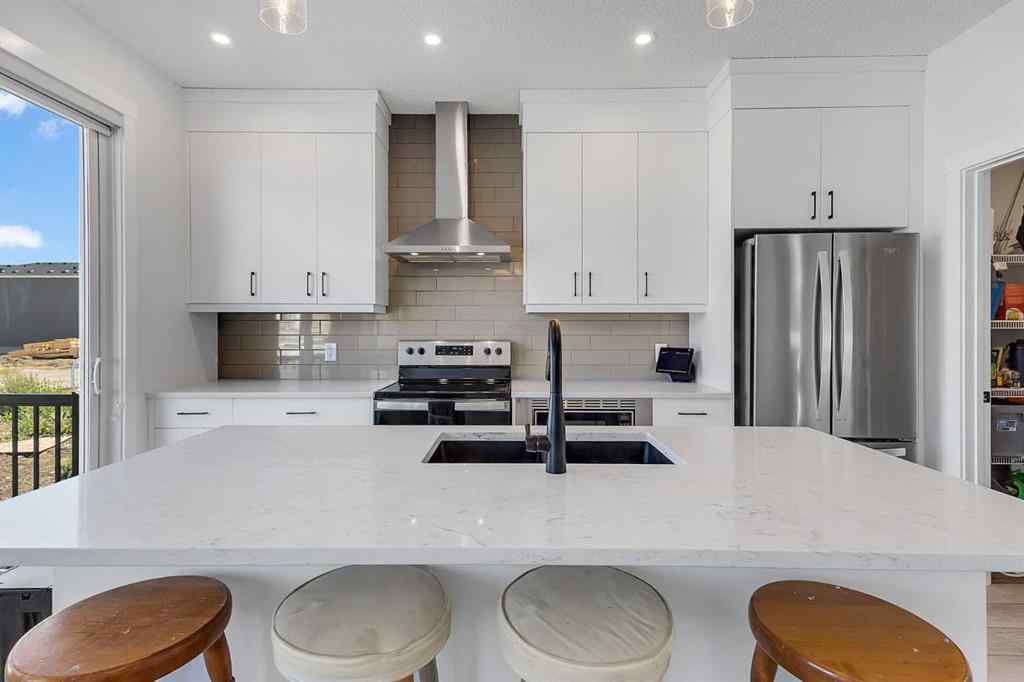 MLS® A2245350 - 21258 SHERIFF KING Street SW in Pine Creek Calgary, Residential
