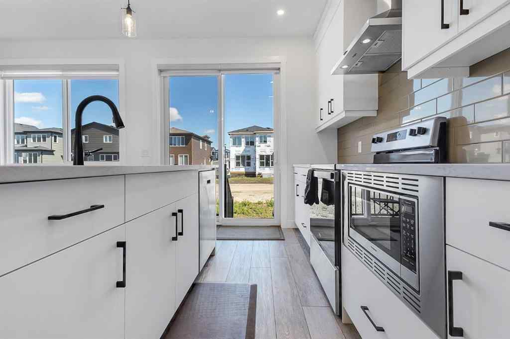 MLS® A2245350 - 21258 SHERIFF KING Street SW in Pine Creek Calgary, Residential