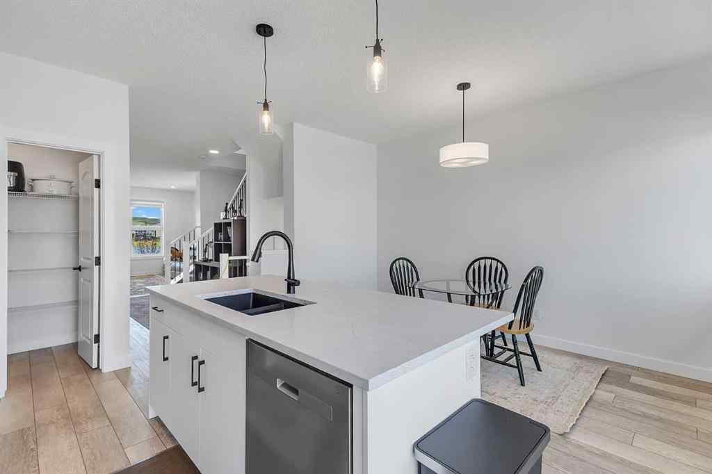 MLS® A2245350 - 21258 SHERIFF KING Street SW in Pine Creek Calgary, Residential