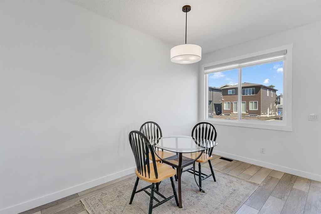 MLS® A2245350 - 21258 SHERIFF KING Street SW in Pine Creek Calgary, Residential