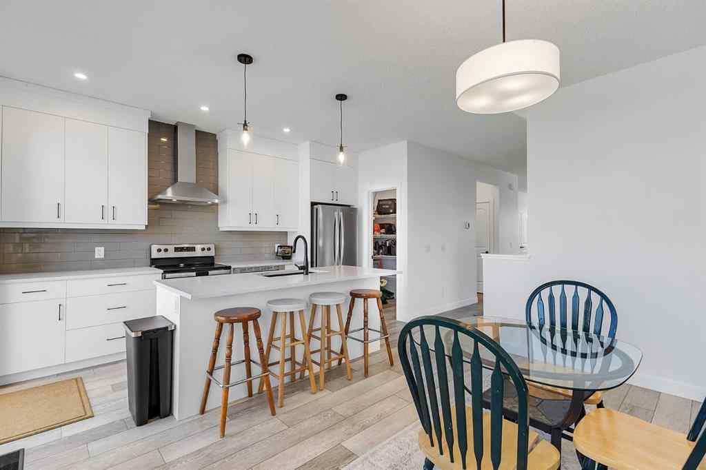 MLS® A2245350 - 21258 SHERIFF KING Street SW in Pine Creek Calgary, Residential