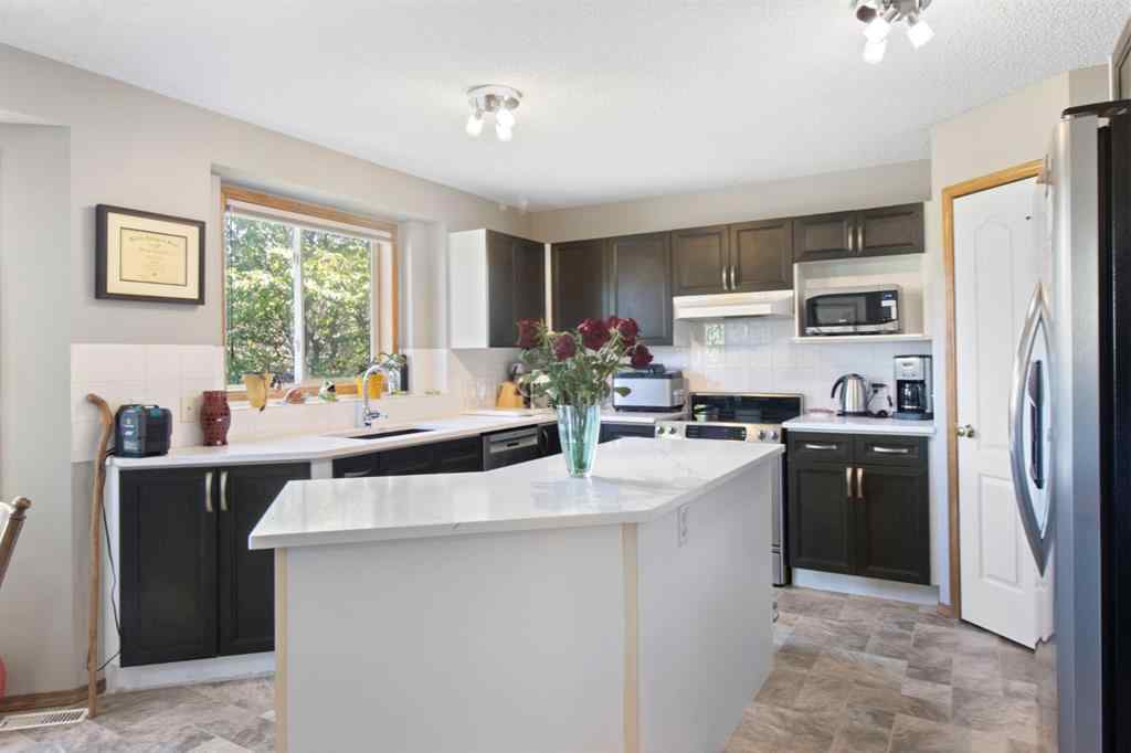 MLS® A2245374 - 21 Arbour Ridge Park NW in Arbour Lake Calgary, Residential