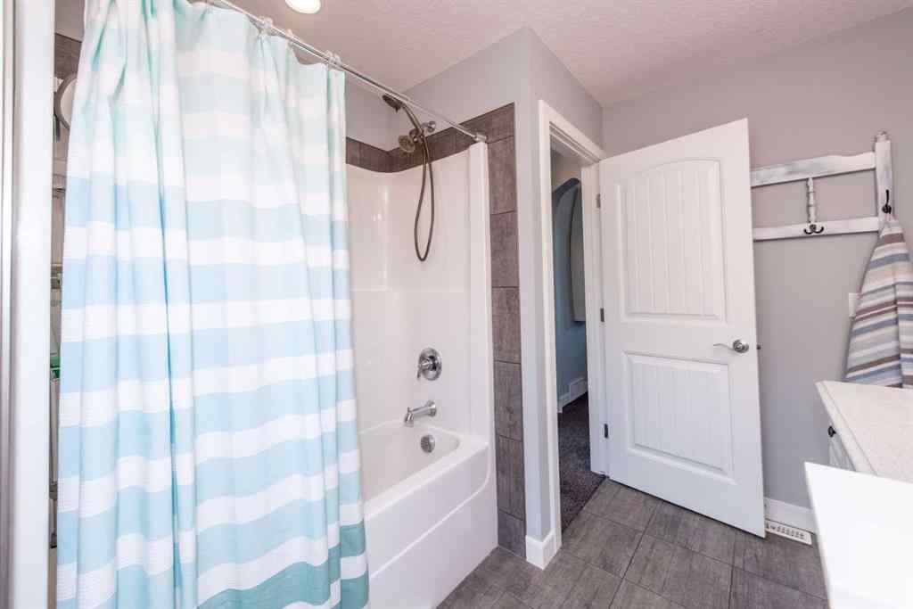 MLS® A2245383 - 103 Ravenskirk Road SE in Ravenswood Airdrie, Residential