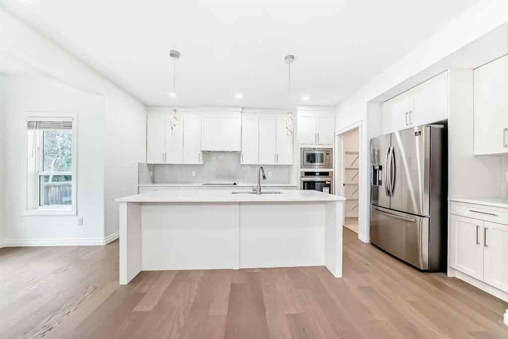 MLS® A2245594 - 18 West Cedar Place SW in West Springs Calgary, Residential