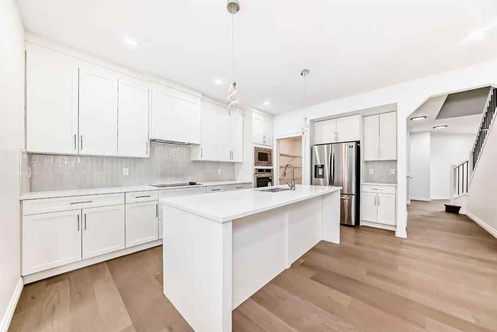 MLS® A2245594 - 18 West Cedar Place SW in West Springs Calgary, Residential