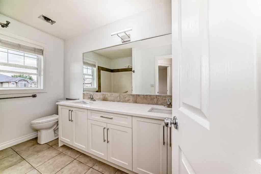 MLS® A2245594 - 18 West Cedar Place SW in West Springs Calgary, Residential