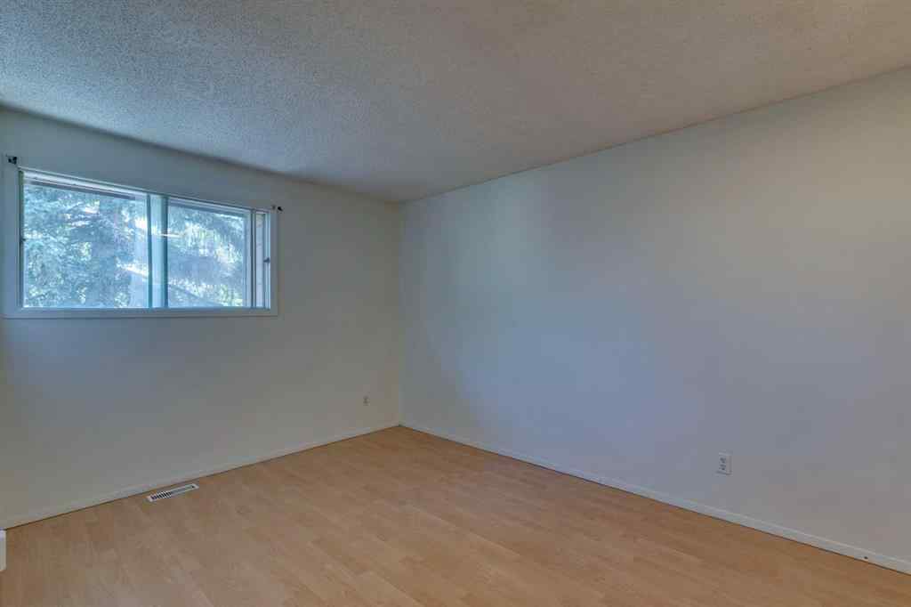 MLS® A2245720 - Unit #111 5404 10 Avenue SE in Penbrooke Meadows Calgary, Residential