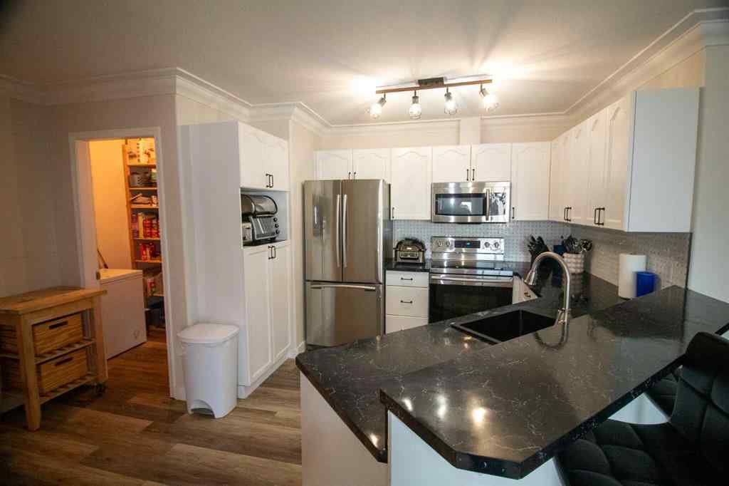 MLS® A2245726 - Unit #103 604 19 Street SE in Sunshine Meadow High River, Residential