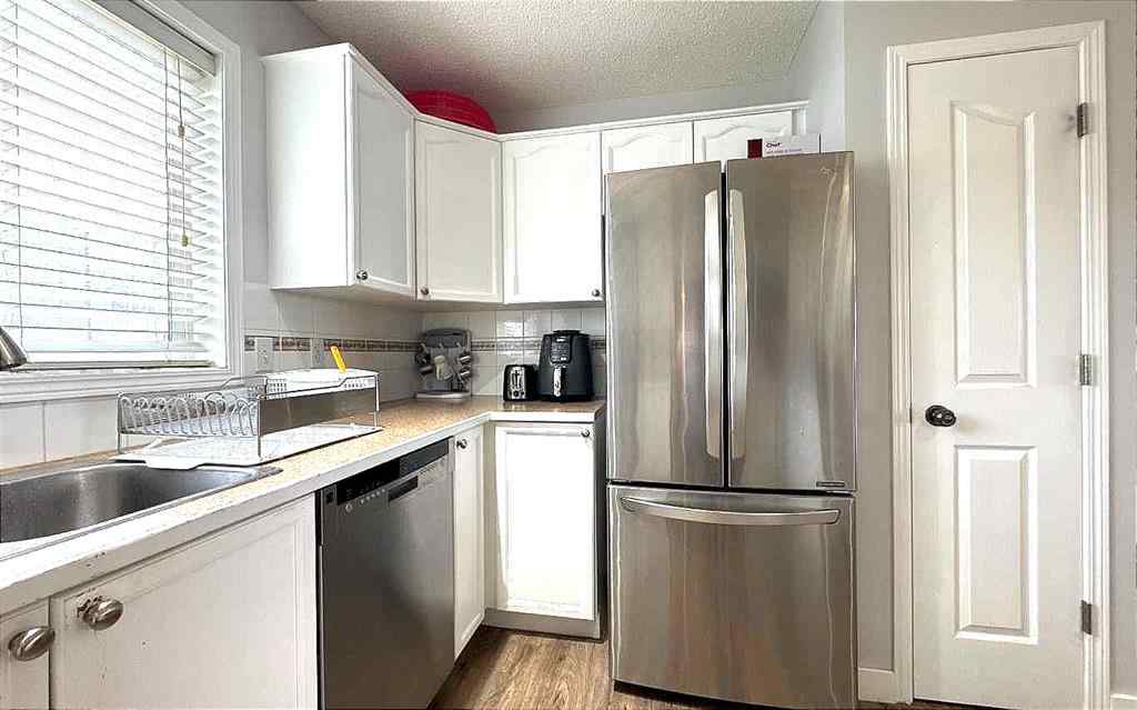 MLS® A2245960 - Unit #8 304 Ross Avenue  in Downtown Cochrane, Residential