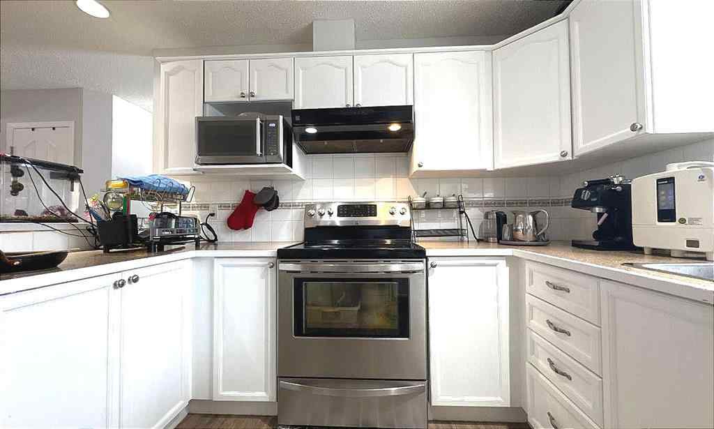 MLS® A2245960 - Unit #8 304 Ross Avenue  in Downtown Cochrane, Residential