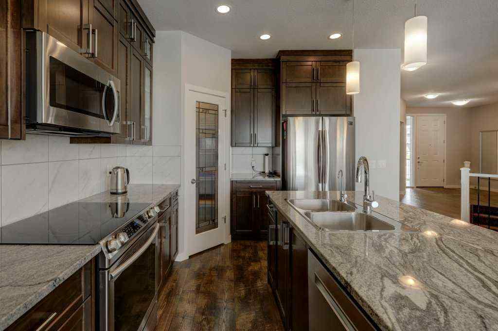 MLS® A2246078 - 2084 Ravensdun Crescent SE in Ravenswood Airdrie, Residential