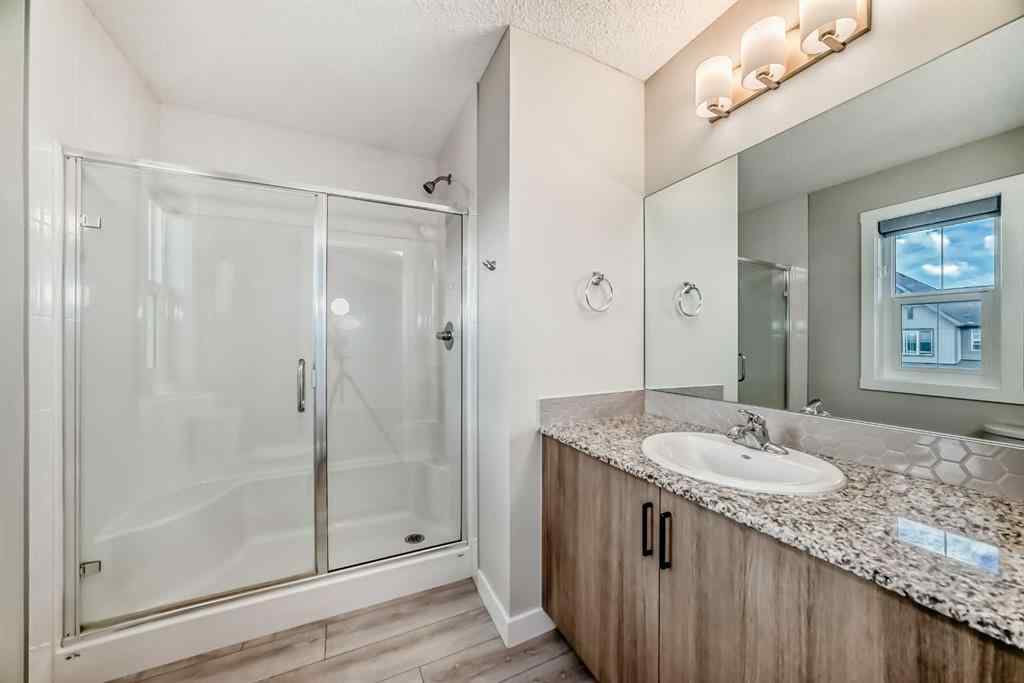 MLS® A2246083 - 221 Midgrove Mews SW in Midtown Airdrie, Residential