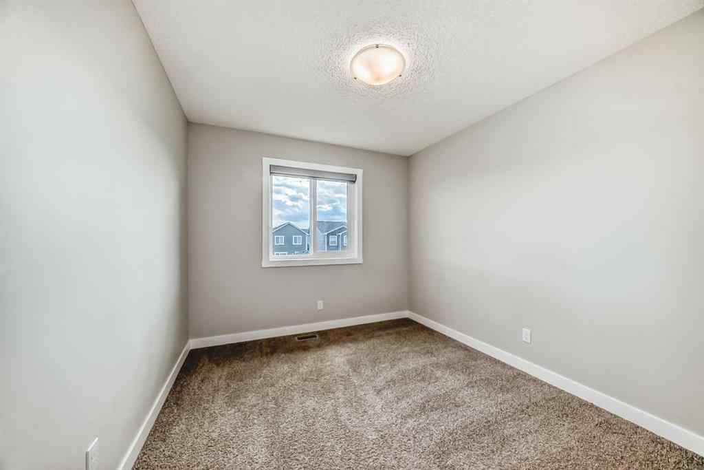 MLS® A2246083 - 221 Midgrove Mews SW in Midtown Airdrie, Residential