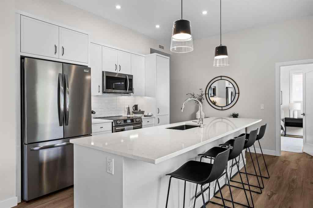 MLS® A2246086 - Unit #101L 209 Stewart Creek Rise  in Three Sisters Canmore, Residential