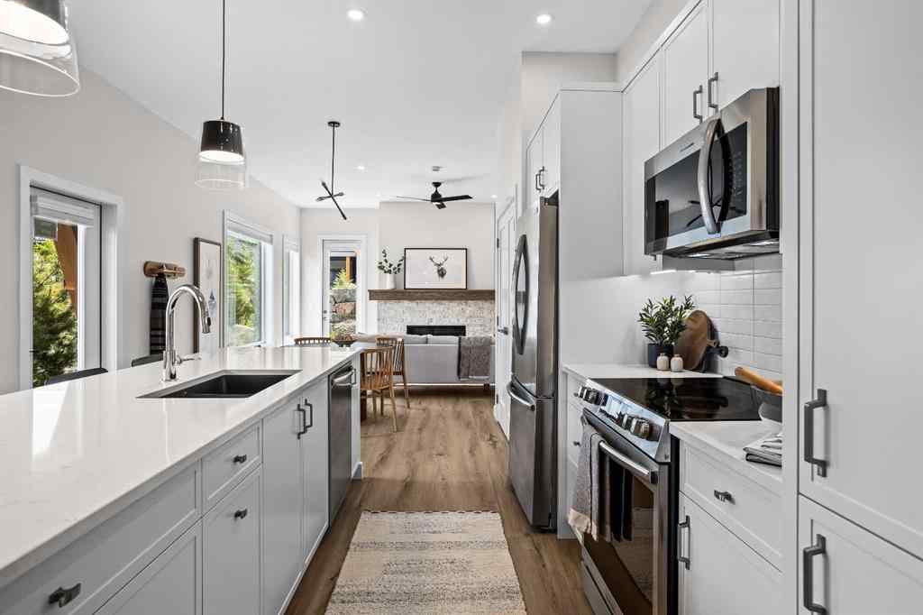 MLS® A2246086 - Unit #101L 209 Stewart Creek Rise  in Three Sisters Canmore, Residential