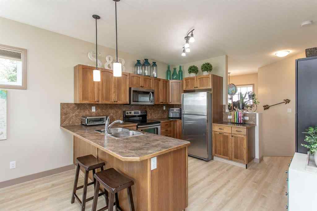 MLS® A2246359 - Unit #22 4546 Iron Wolf Place  in Iron Wolf Lacombe, Residential