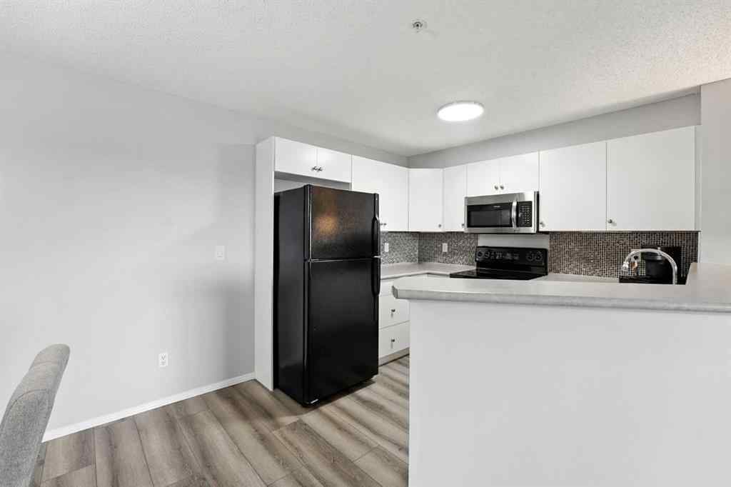 MLS® A2246603 - Unit #7204 304 Mackenzie Way SW in Downtown Airdrie, Residential