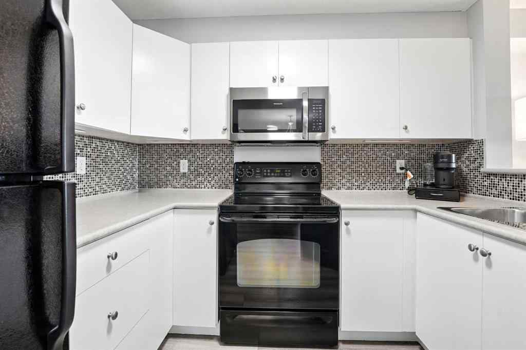 MLS® A2246603 - Unit #7204 304 Mackenzie Way SW in Downtown Airdrie, Residential