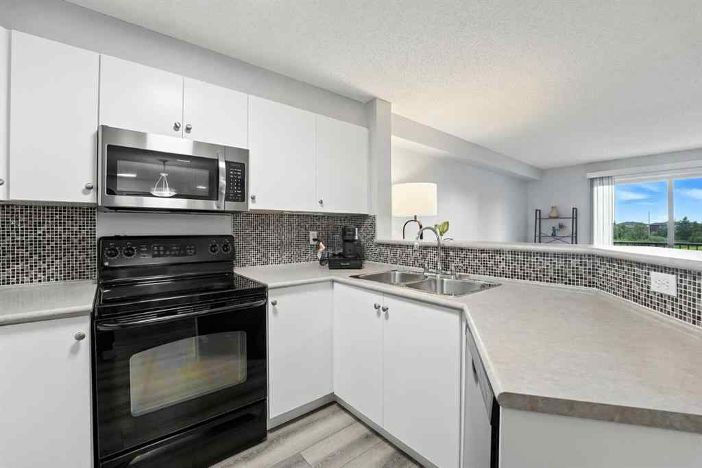 MLS® A2246603 - Unit #7204 304 Mackenzie Way SW in Downtown Airdrie, Residential