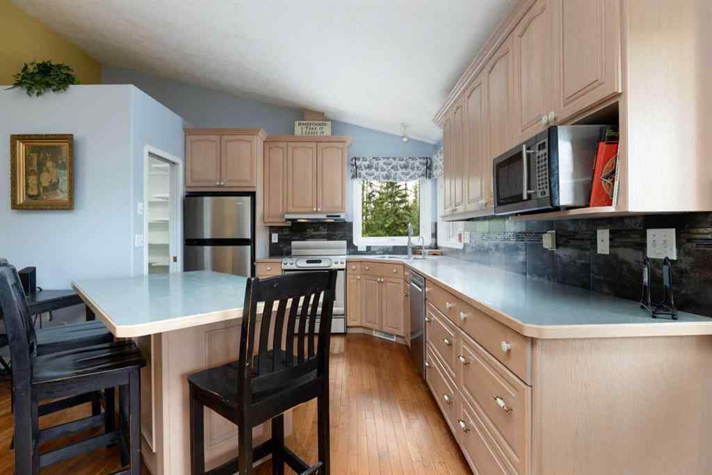 MLS® A2247035 - 115 Community Lane  in Saprae Creek Estates Saprae Creek, Residential