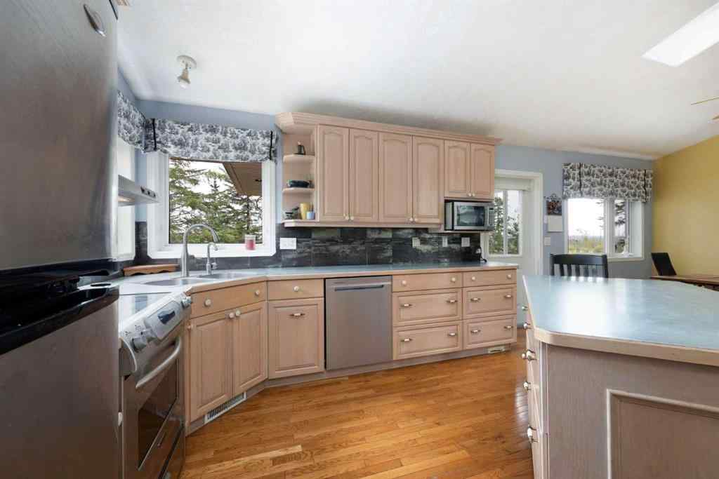 MLS® A2247035 - 115 Community Lane  in Saprae Creek Estates Saprae Creek, Residential