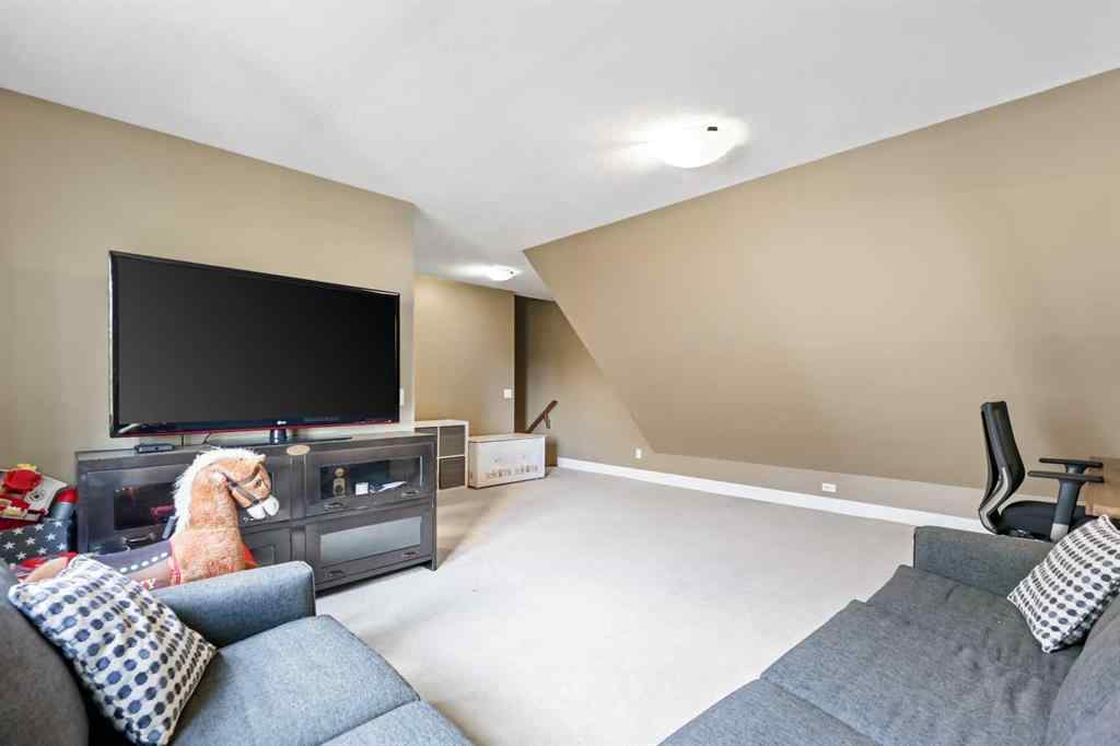 MLS® A2247309 - 140 Mike Ralph Way SW in Garrison Green Calgary, Residential
