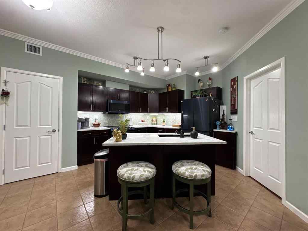 MLS® A2247341 - Unit #203 5040 53 Street  in Downtown Sylvan Lake, Residential
