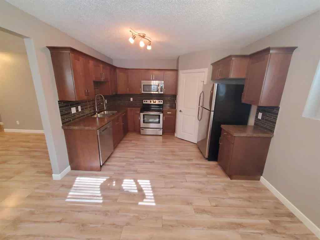 MLS® A2247372 - 10211 125 Avenue  in Northridge Grande Prairie, Residential
