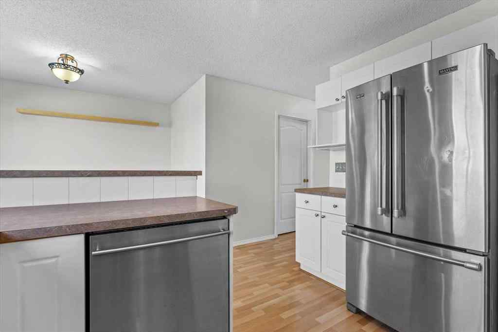 MLS® A2247480 - 911 Arbour Lake Road NW in Arbour Lake Calgary, Residential