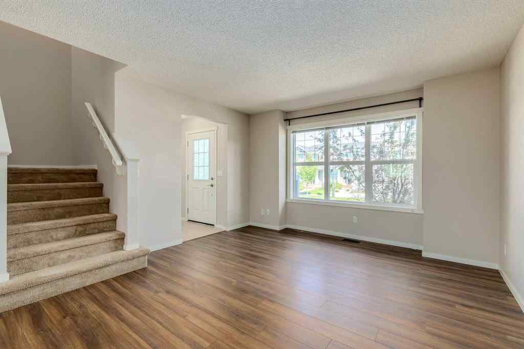 MLS® A2247610 - 44 Sunvalley Road  in Sunset Ridge Cochrane, Residential
