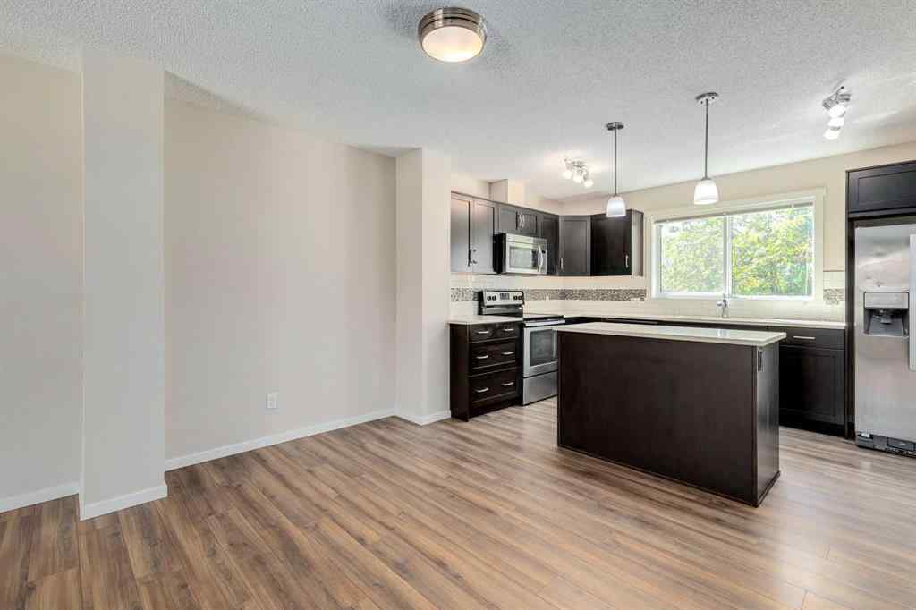 MLS® A2247610 - 44 Sunvalley Road  in Sunset Ridge Cochrane, Residential
