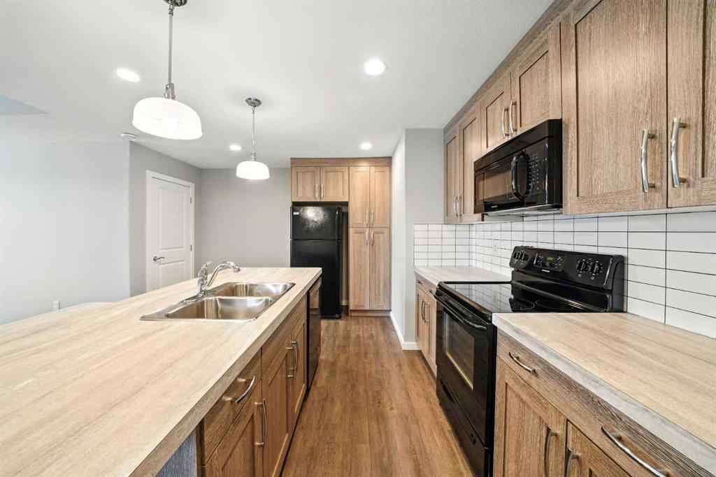 MLS® A2247626 - Unit #100 44 Reid Court  in Ryders Ridge Sylvan Lake, Residential