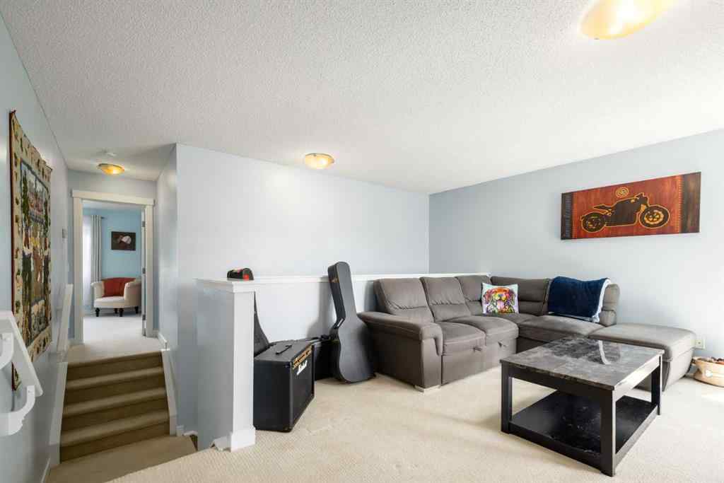 MLS® A2247739 - 84 Sunset Manor  in Sunset Ridge Cochrane, Residential